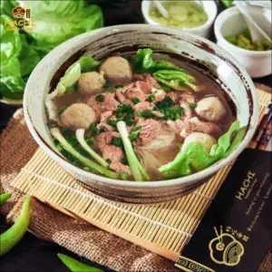 Pho with rare beef and beef meatballs