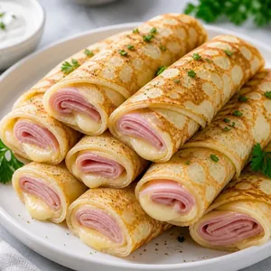 Blini with ham and cheese