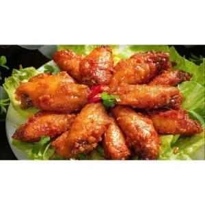 Fried rice with fried chicken wings in spicy and sour sauce