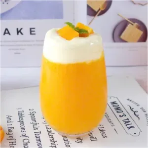 Green tea with mango and cheese foam