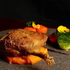Duck confit with mashed pumpkin, balsamic sauce