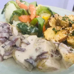 Chicken boscaiola with sauteed baby potato and vegetables, bacon mushroom sauce