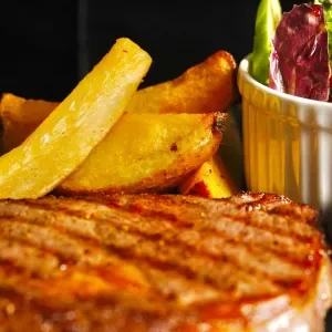 Australian ribeye steak with French fries and Phu Quoc green pepper sauce
