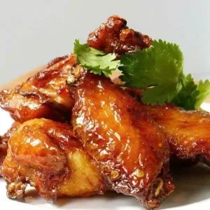 Fried rice with fried chicken wings in honey sauce